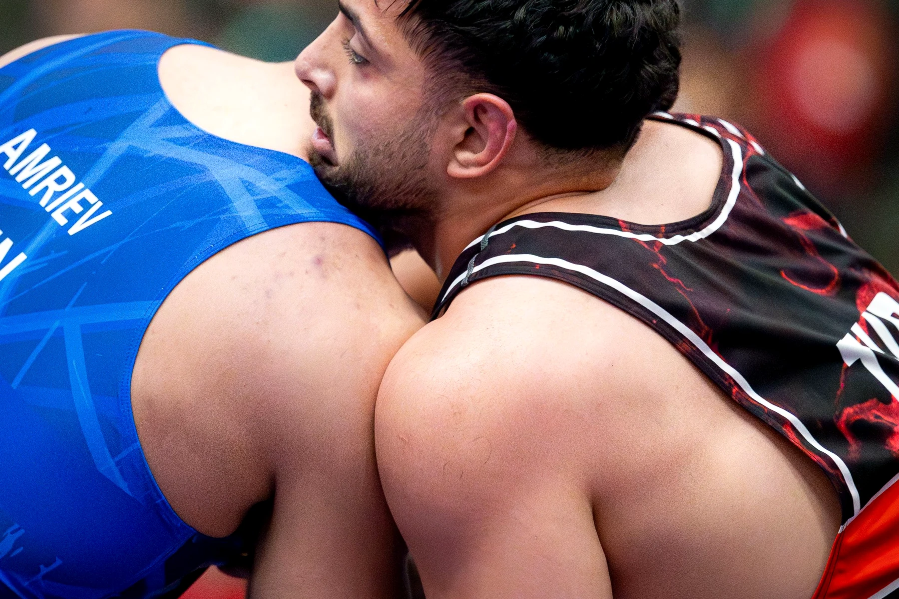 Freestyle wrestlers working through a close hand-fighting position