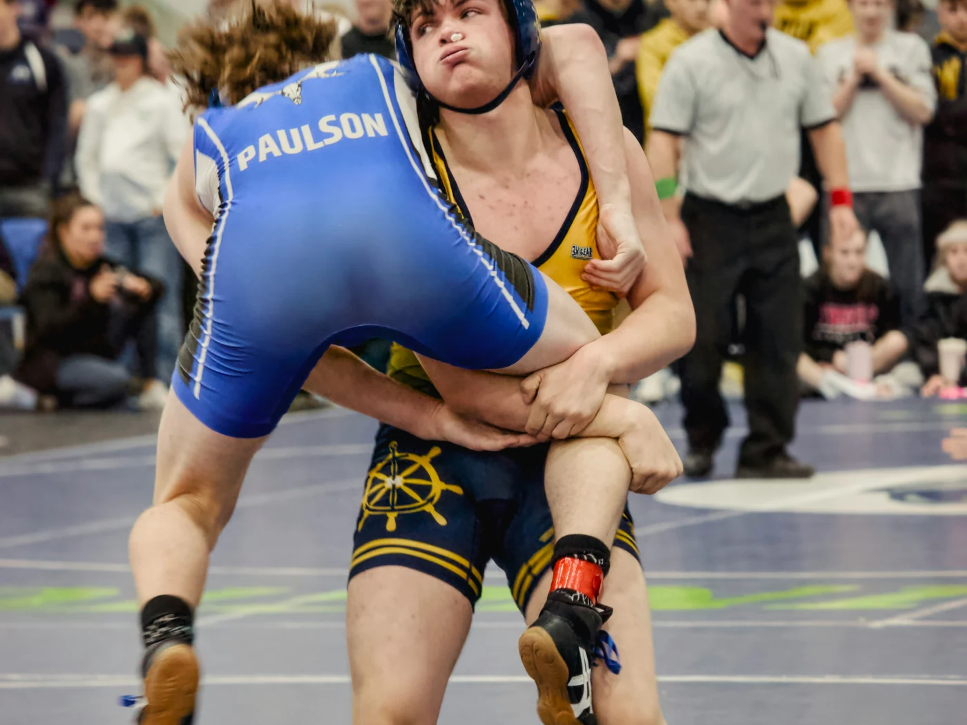 Freestyle wrestlers hand fighting in close position